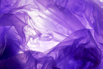 Plastic bag background. Purple texture, grunge style, textured background with copy space for text.