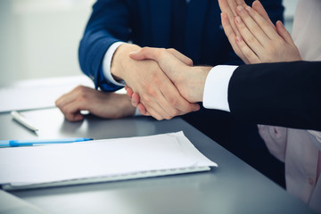 Business people shaking hands finishing up a meeting. Handshake at successful negotiation