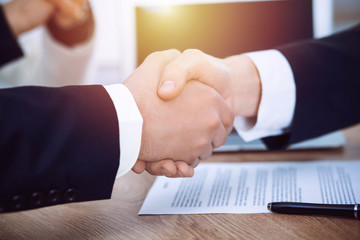 Business people shaking hands at meeting or negotiation in the office. Handshake concept. Partners are satisfied because signing contract