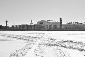 View of the arrow of Vasilievsky Island and frozen Neva river.