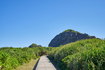 Beautiful scenic of offshore Sanxiantai islands with long footpath through the hills in the east coast of Chenggong city, Taitung, Taiwan.