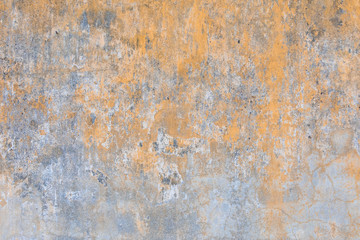 Yellow old faded wall texture background