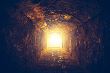 Light in end of dark tunnel or corridor, toned. Way to hope and freedom concept