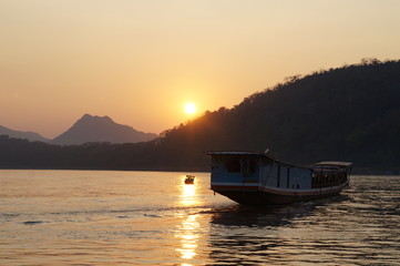boat on lake at sunset
