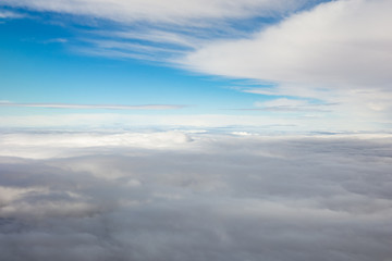 Cloudscape with clouds above and beneath