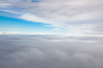 Fototapeta premium Cloudscape with clouds above and beneath