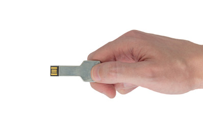 USB Flash Drive Disk shaped like a key in hand on isolated white background