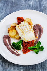 Cod loin with black olives puree and sundried tomatoes