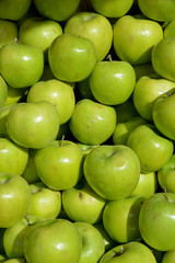 green apples on background