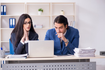 Two employees working in the office 