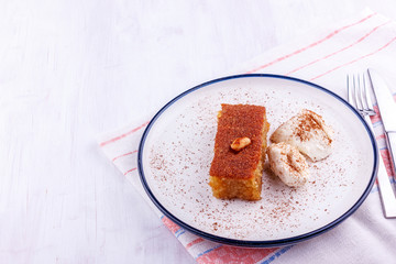 Traditional Turkish dessert - sambali, sambaba or damascus with cream and cinnamon powder