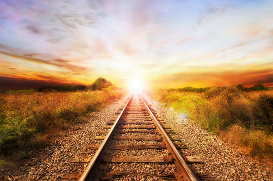 Landscape of an old abandoned railway at the sunrise. Sunny summer day.