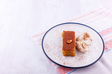 Traditional Turkish dessert - sambali, sambaba or damascus with cream and cinnamon powder