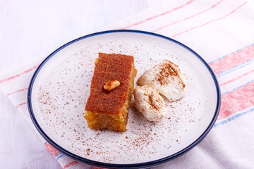 Traditional Turkish dessert - sambali, sambaba or damascus with cream and cinnamon powder