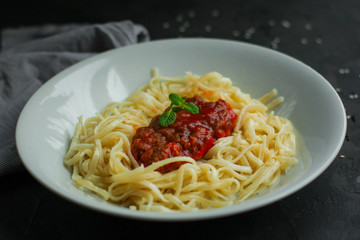 pasta, Spaghetti or Bucatini and ingredients for the sauce - portion. food background. copy space