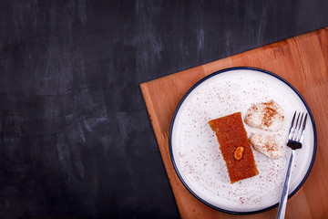 Traditional Turkish dessert - sambali, sambaba or damascus with cream and cinnamon powder