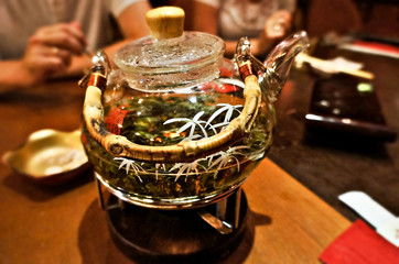 glass teapot on wooden table