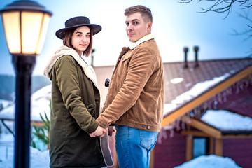 Lovers on the background of the house. Home for a new family. The family chooses the house. Buying a home.