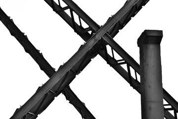 Industrial background on the shore of the Black sea at Constanta Maritime Harbor, Romania. Black and white image.