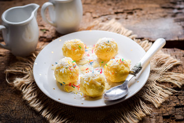 Cottage cheese balls in colored dressing.