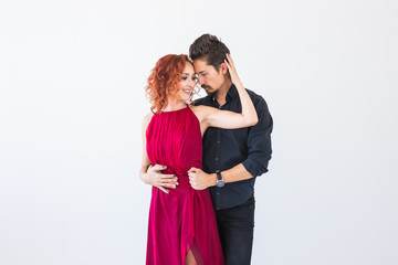 Social dance, bachata, kizomba, salsa, tango concept - Close up portrait of woman man dressed in beautiful outfits over white background