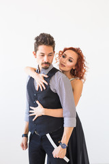 Social dance, bachata, kizomba, people concept - Young pretty woman in pink dress and man dancing waltz or salsa