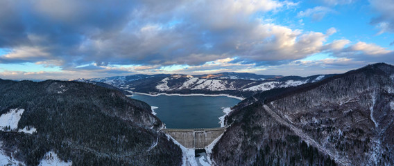 Aerial view of energy dam in winter