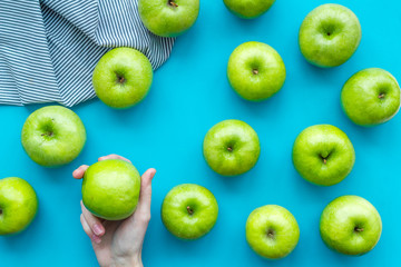 summer food with apples on blue background top view pattern