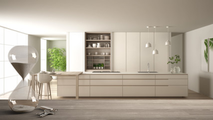 Wooden table, desk or shelf with crystal modern hourglass measuring passing time in a countdown to a deadline over modern kitchen, architecture interior design, copy space background