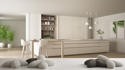 White table, desk or shelf with five soft white pillows in the shape of stars or flowers, over blurred modern wooden kitchen, white architecture interior design concept