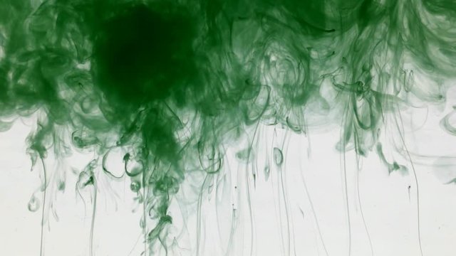 Many paint streams in water, green colored ink.