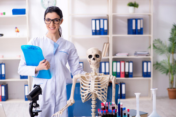 Young female archaeologist working in the lab 