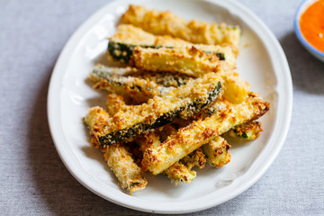 Zucchini fries with roast pepper and tomato sauce