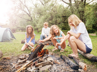 Teen in the camp by the fire