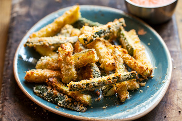 Zucchini fries with roast pepper and tomato sauce