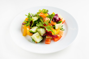vegetable salad on the white plate