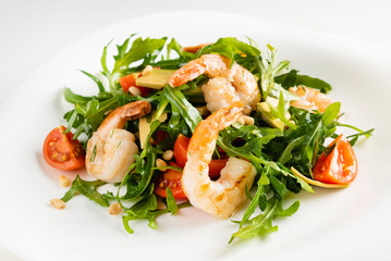 salad with shrimps, rocket salad and cherry tomatoes
