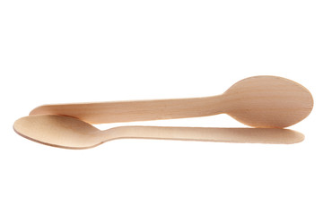 Eco-friendly materials. Wooden, disposable spoon on a white background.