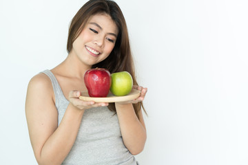 Fototapeta premium Healthy organic food for dieting woman concept. Woman carry green apple isolated on white background.