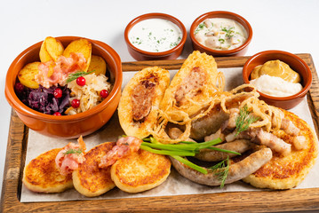 potato cutlets with sausages and sauce