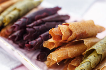 Closeup set of colorful pastillum rolls on tray