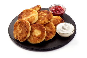 Gourmet Breakfast - Cottage cheese pancakes with jam and sour cream, close-up, isolated on white background
