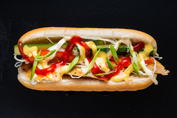 hot dog on the black background