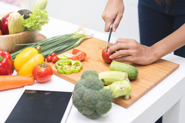 Close up woman preparing ingredient for salad.