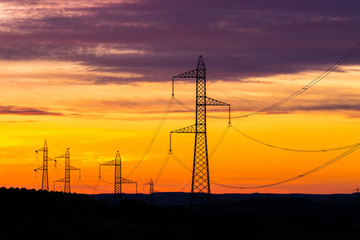 Fototapeta na wymiar high voltage tower at sundown