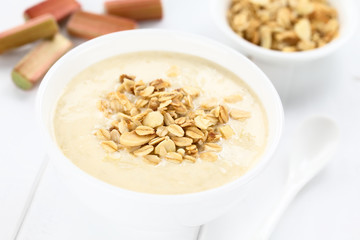 Refreshing rhubarb and yogurt dessert or cold soup topped with homemade oatmeal and almond granola...