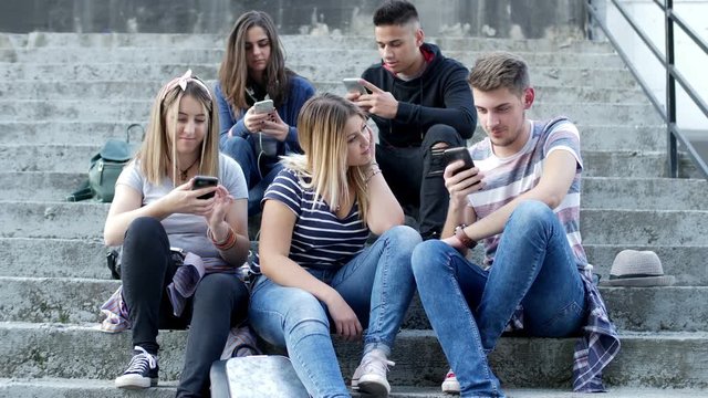 Girl filling boring with her friends who obsessed with social networks