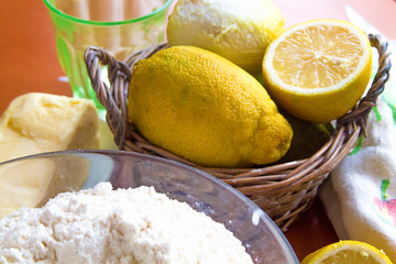 lemons in a wicker basket are on the table