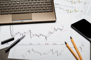 Currency charts on paper, Forex profit calculation, broker workplace
