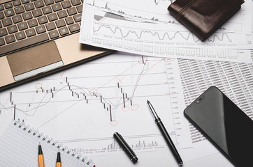 The workplace of the financier, graphics on paper, analysis forex